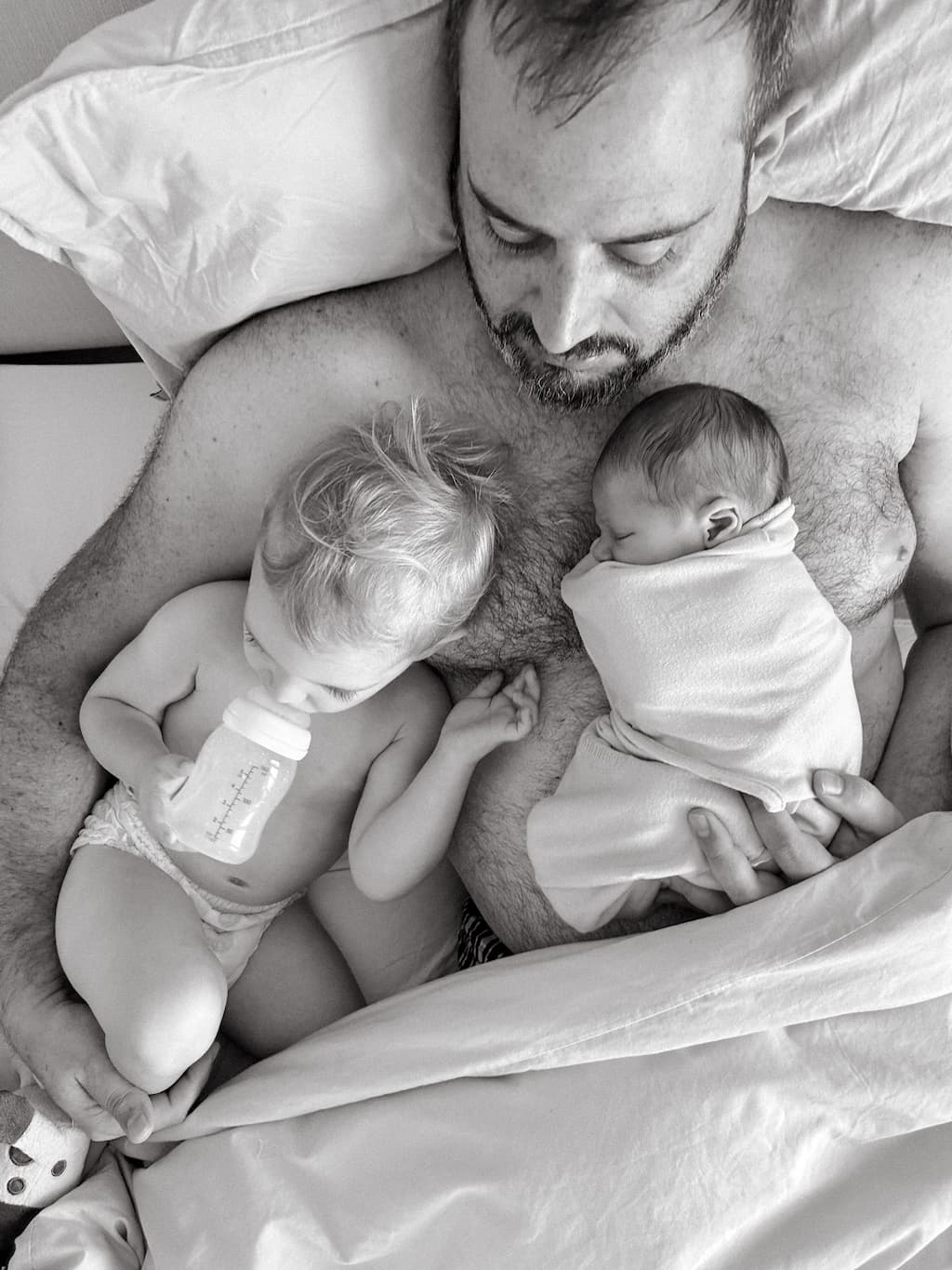 Dylan with both kids as babies